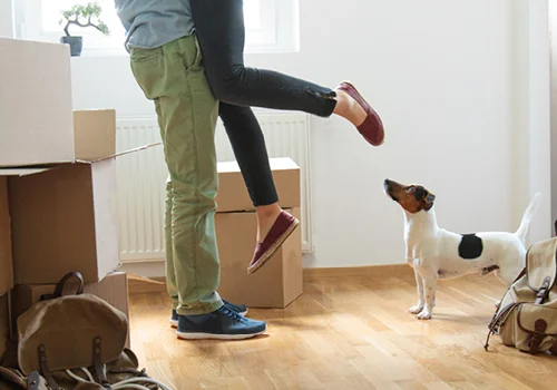 Couple moving into new house with dog
