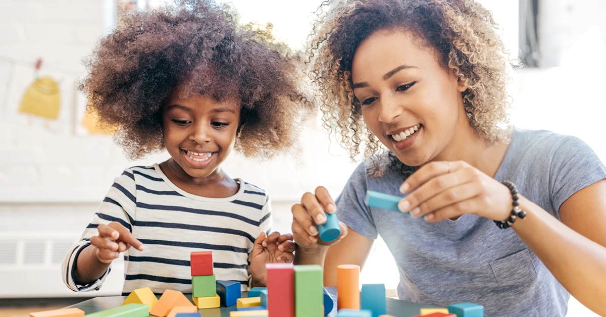 Woman Playing Blocks with Kid
