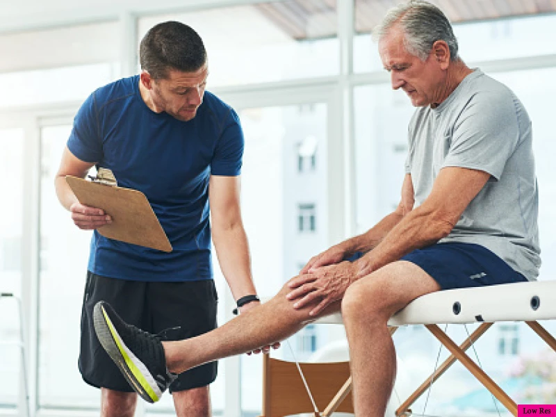 Man getting leg checked out by trainer